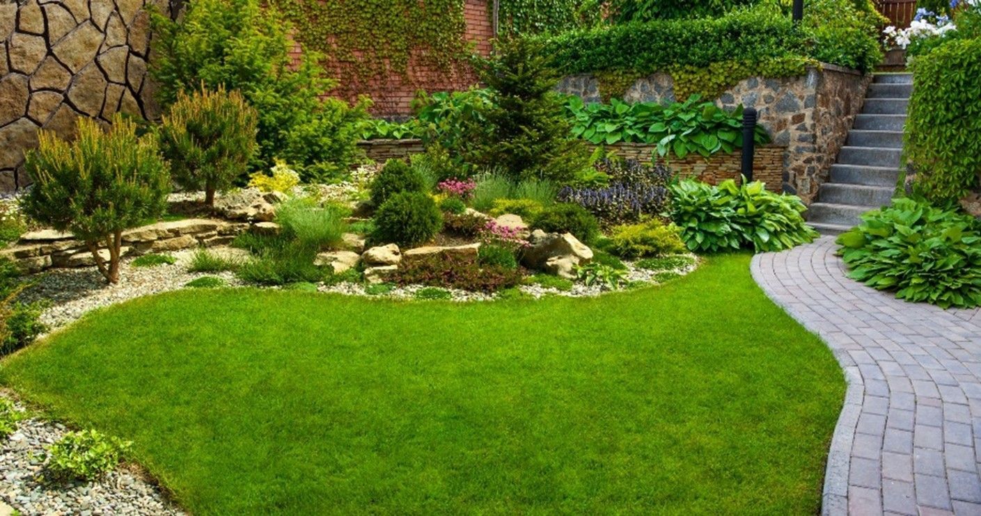 Professionally designed garden showcasing landscape installation service, with integrated hardscape.
