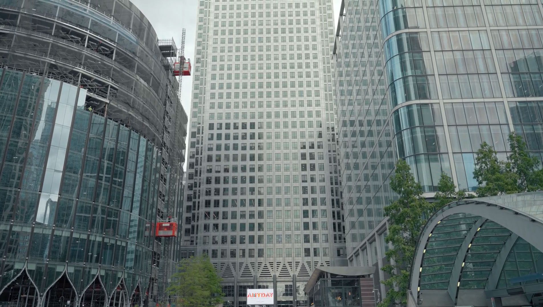 A group of tall buildings are sitting next to each other in a city.