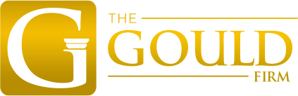 Gold and white “The Gould Firm” logo with a large stylized G and gavel icon