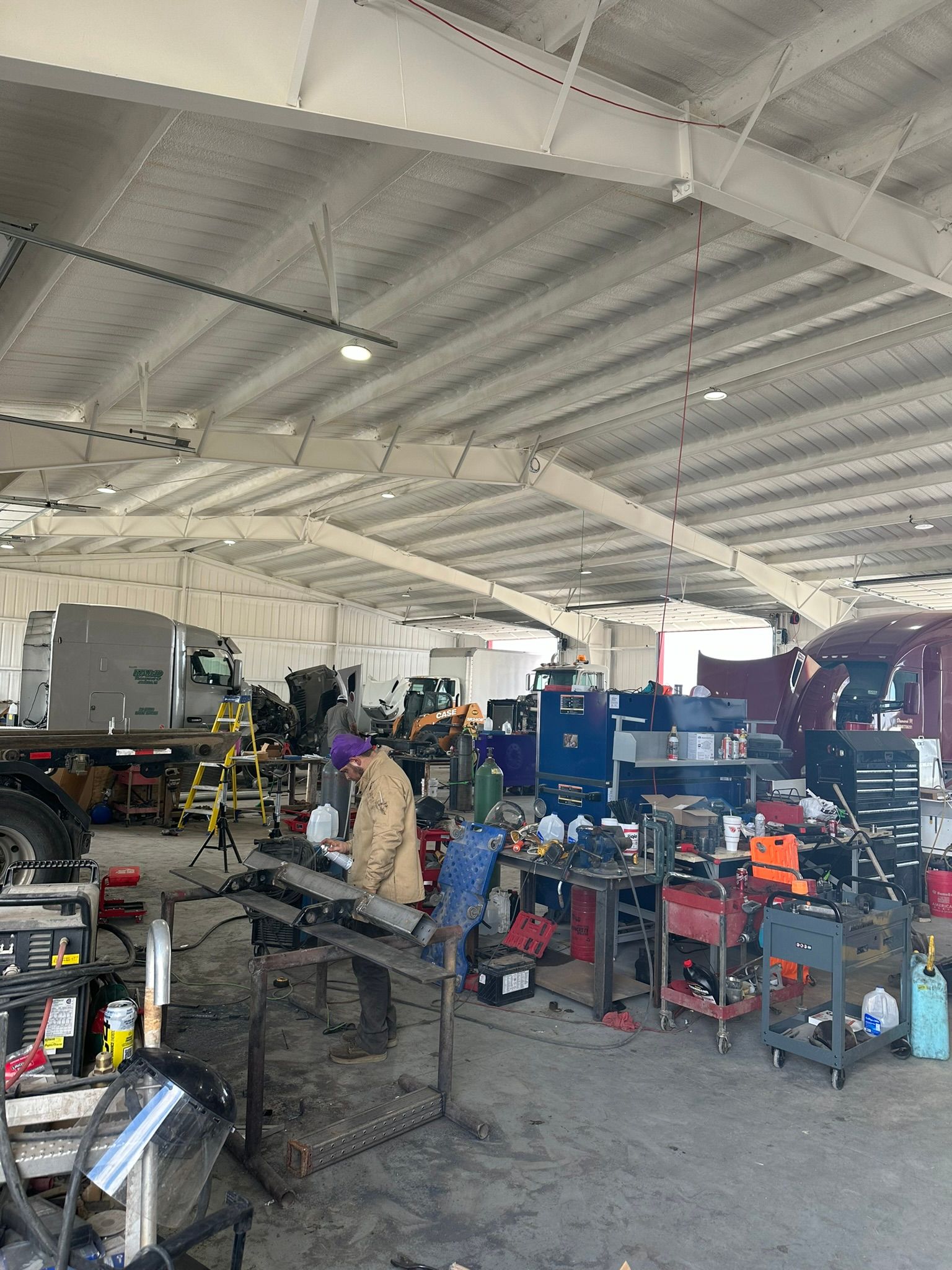 A large warehouse filled with lots of tools and machinery.