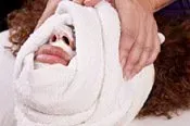 Step 3 - Steam face with herbal tea soaked towels Step 3 - Steam face with herbal tea soaked towels
