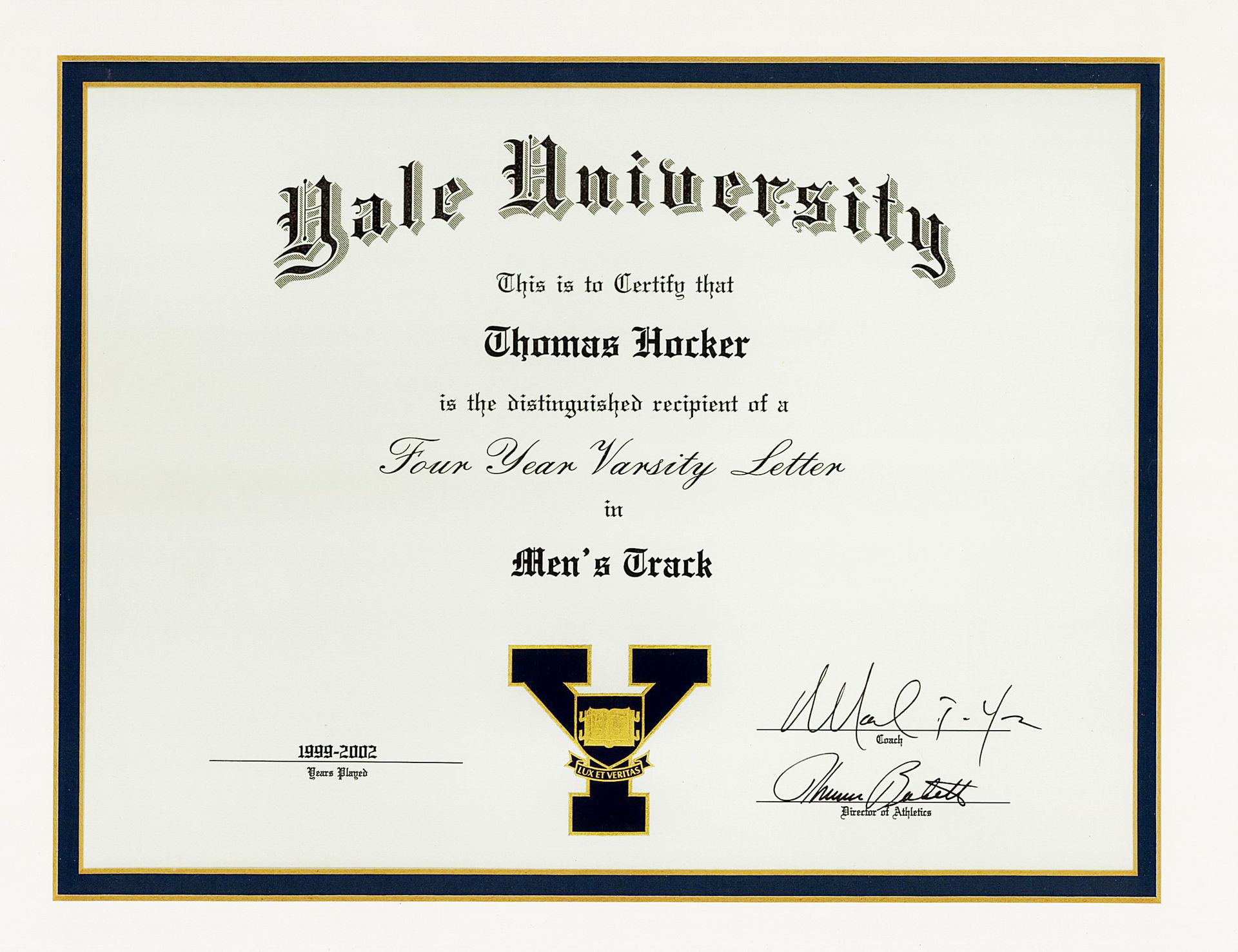 Yale University diploma with black and gold border and signatures on white parchment