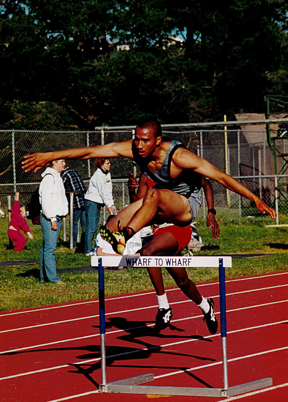 Thomas Hocker jumping over a track hurdle