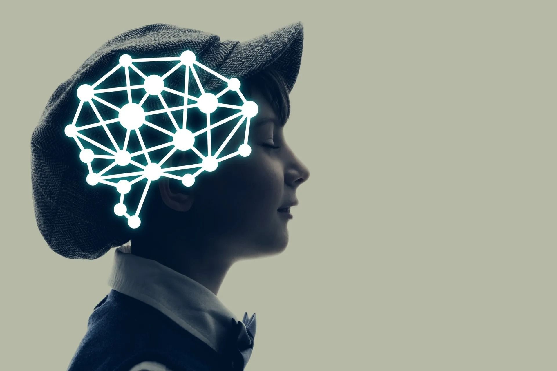 Profile silhouette with glowing brain network overlay on a dark background