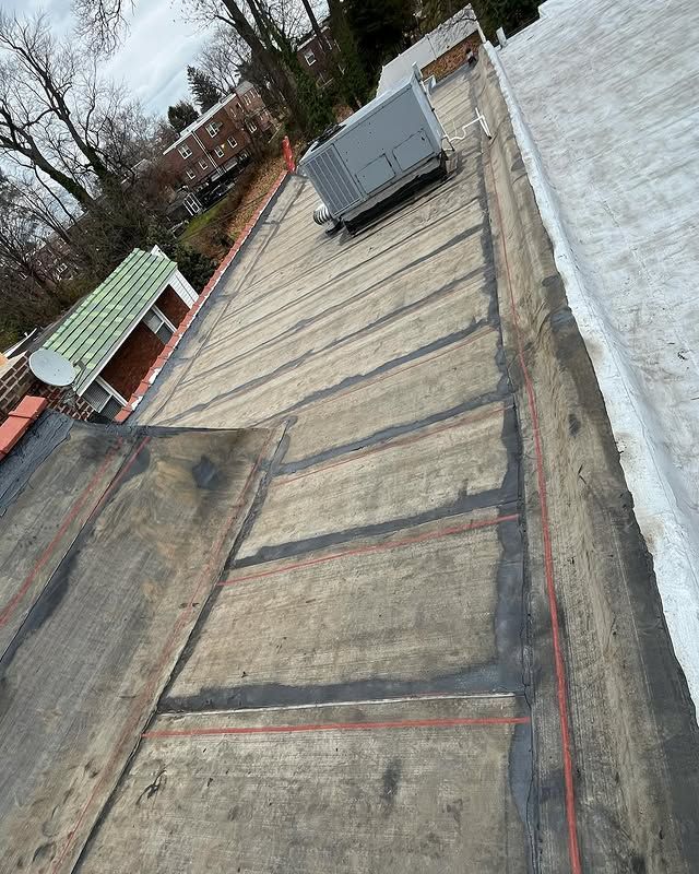 An aerial view of a roof with a box on top of it.