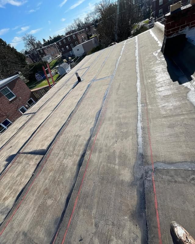 A person is standing on the roof of a building.