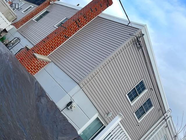 A house with a chimney on the side of it