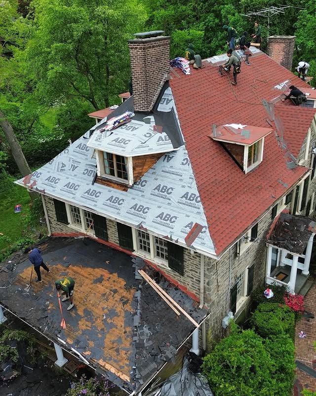An aerial view of a house being remodeled with a new roof.