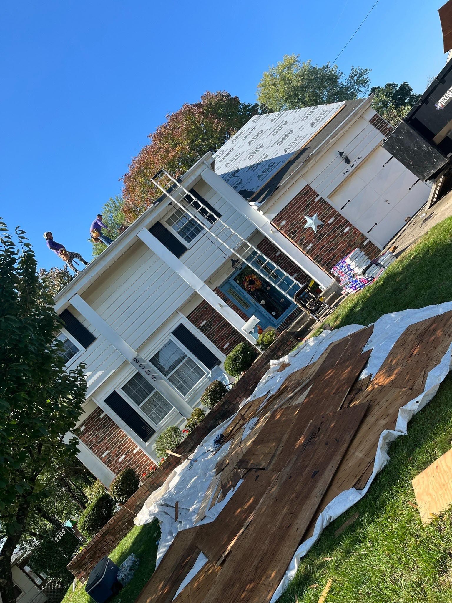 A house with a roof that is being repaired.