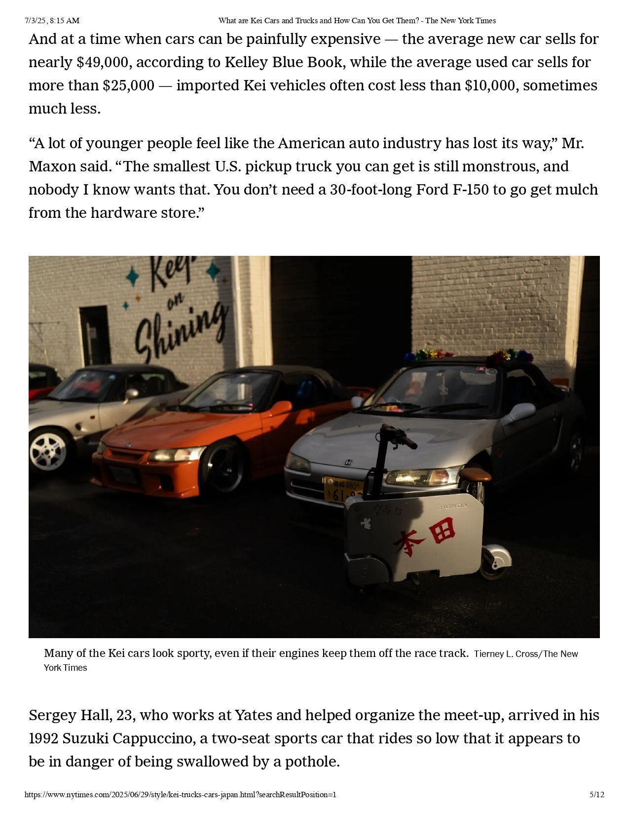 Three compact cars, including an orange one, parked outside a building with a 