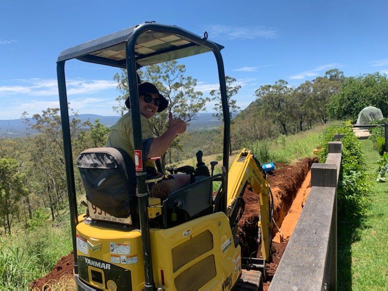 Stormwater drainage installation - excavator hard at work