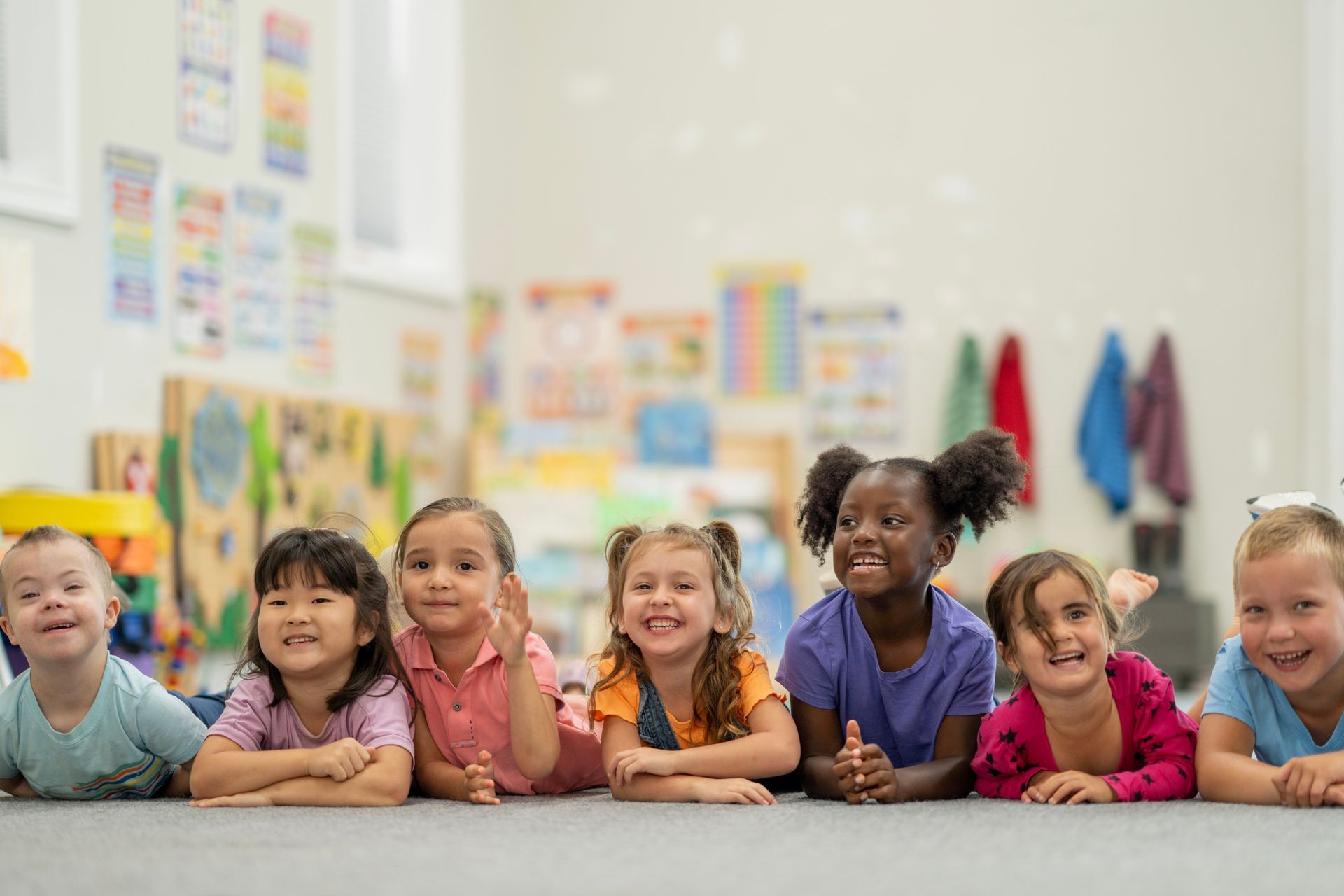 A group of children of diverse backgrounds are smiling. A group of children of diverse backgrounds are smiling.