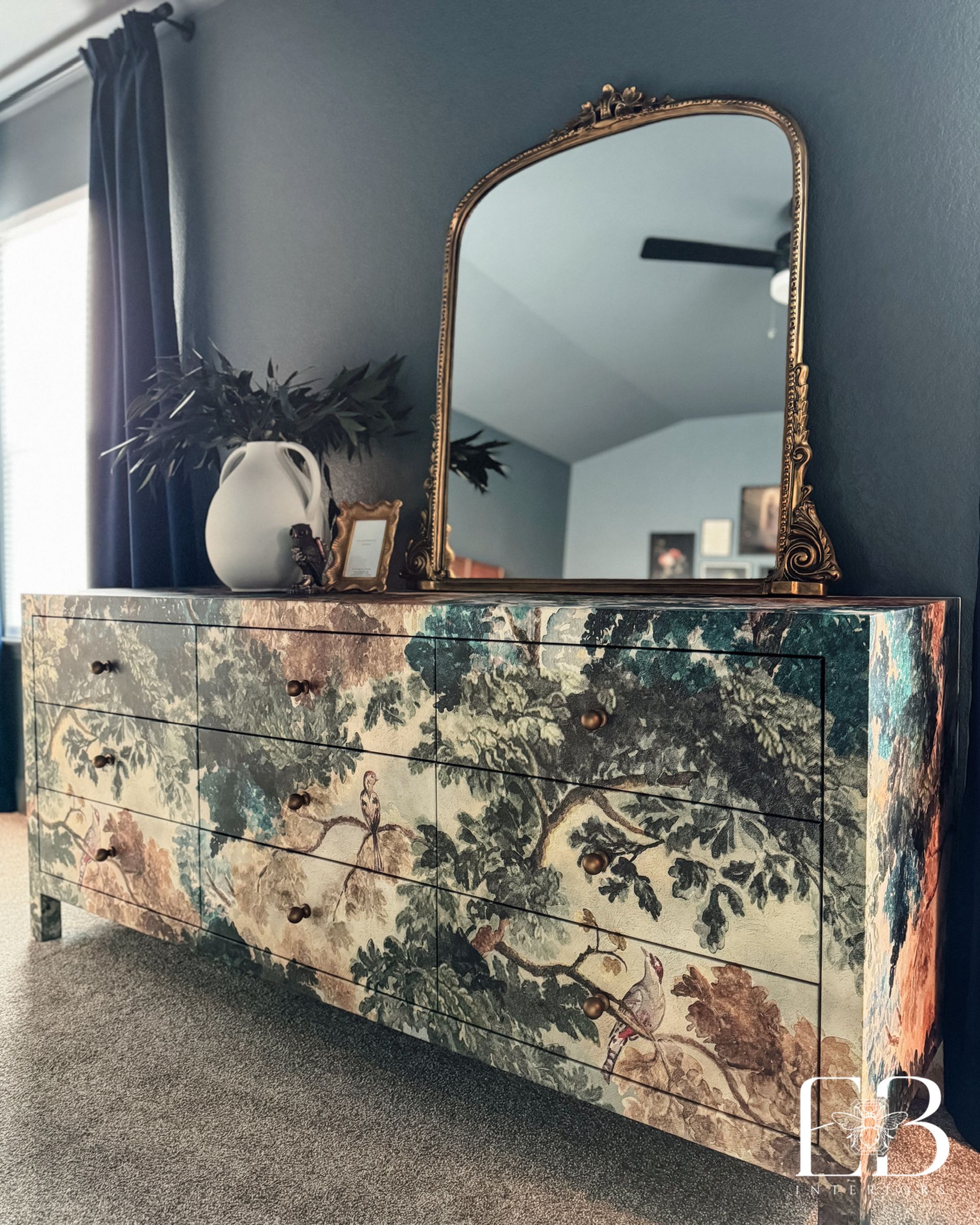 Botanical dresser with brass hardware and vintage-look mirror styled by Emerald Bee Interiors for the St. Cindy’s Way suite.