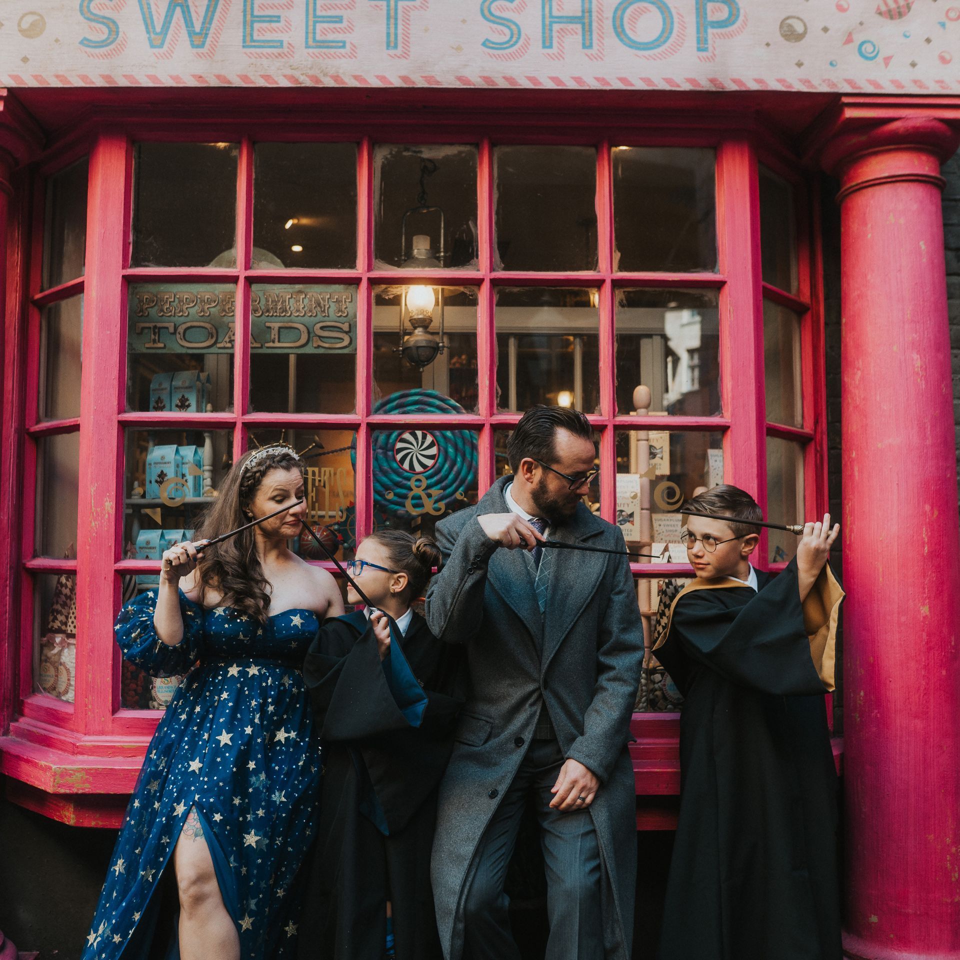 Emily Mussett and family in Harry Potter attire captured in the Wizarding World for Emerald Bee Interiors lifestyle imagery.