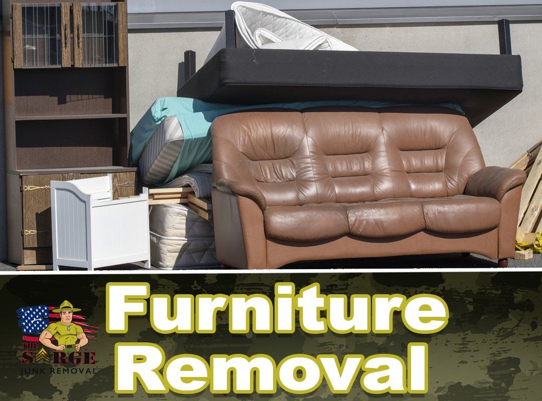 Furniture piled up for removal, including a sofa, bed, and cabinet; text reads