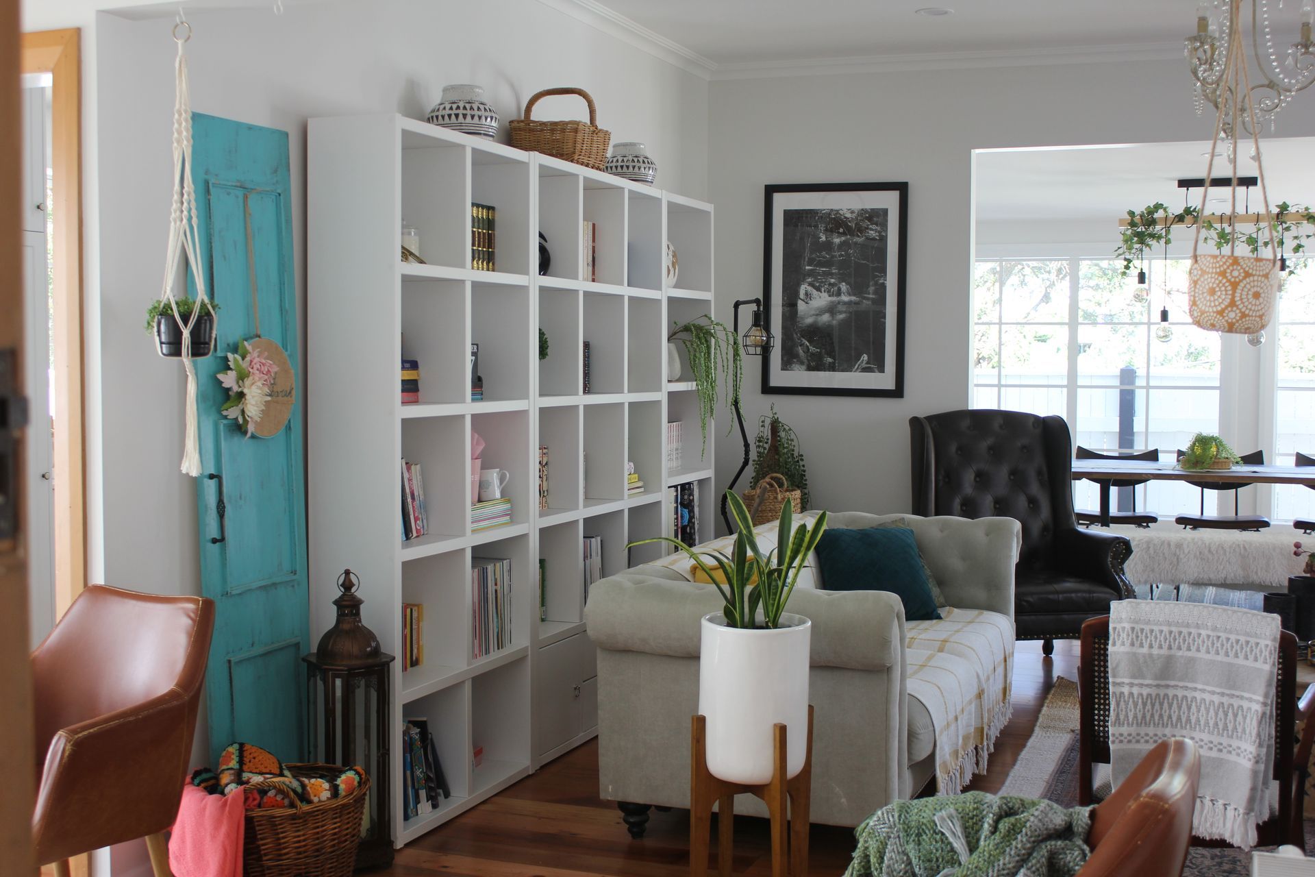 A living room filled with furniture and a bookshelf.