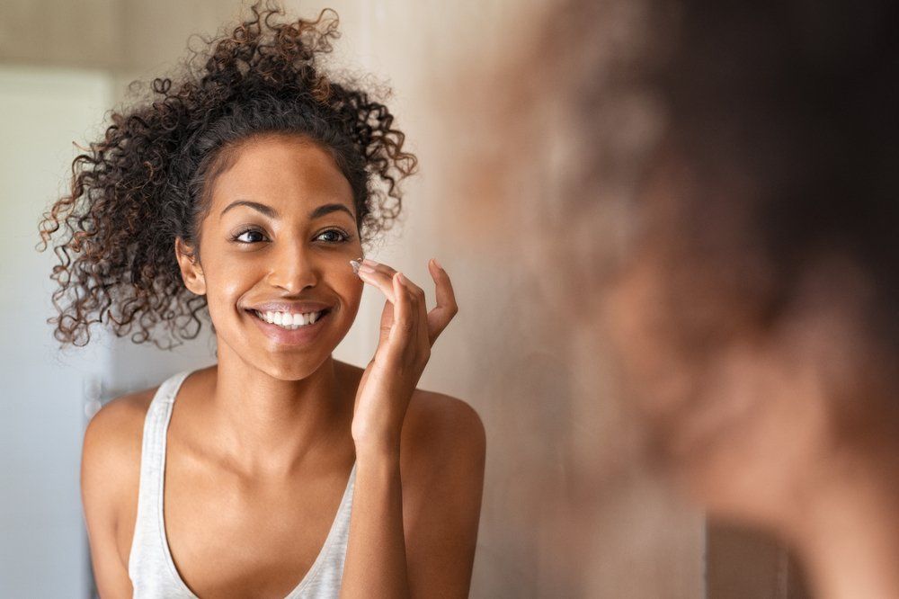 Woman Using Beauty Products