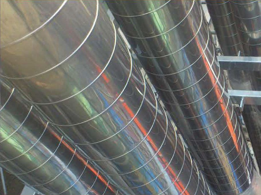 Shiny, insulated Ducts with metal bands, arranged parallel overhead.