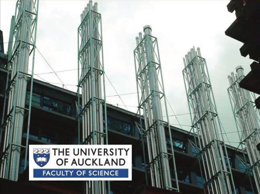 Exterior view of University of Auckland Faculty of Science building with tall, silver ventilation stacks.