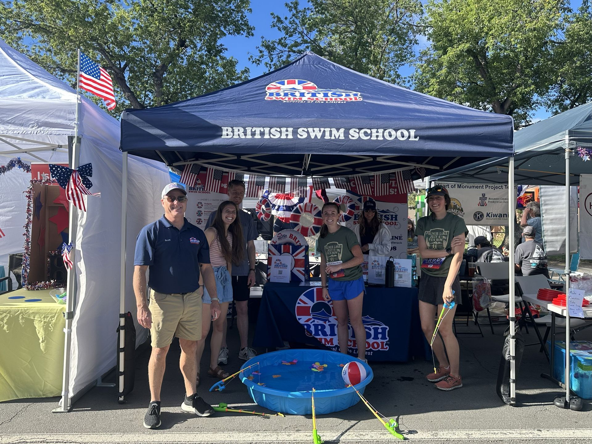 British Swim School at their booth during the 4th of July parade