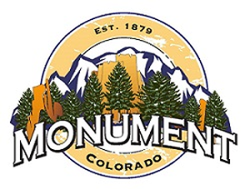 Monument, Colorado town logo with mountains, trees, and text.