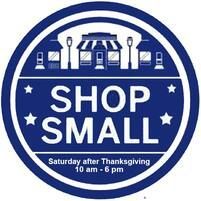 Blue circular Shop Small logo with a downtown scene and text: