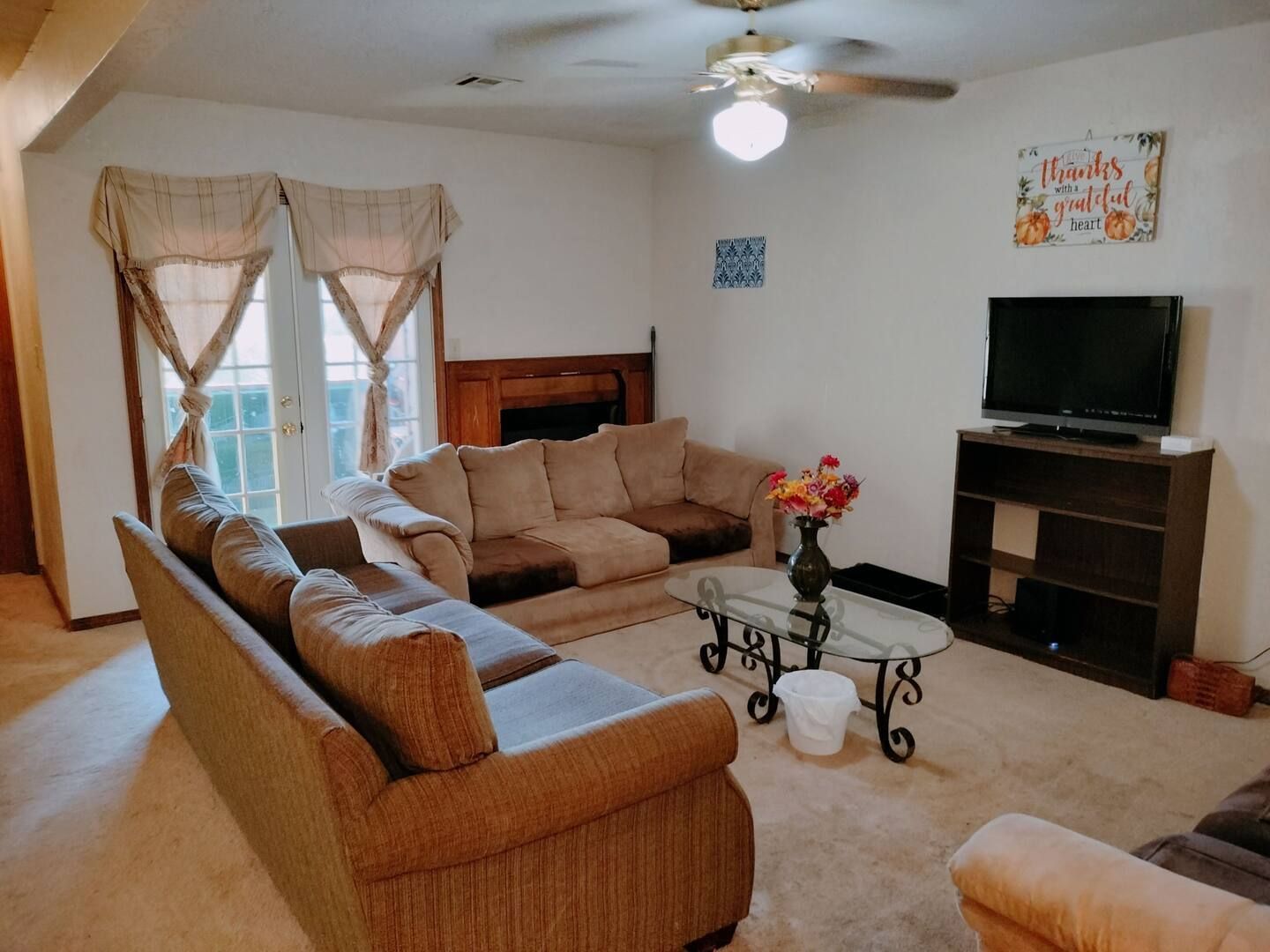 A living room with a couch and a television