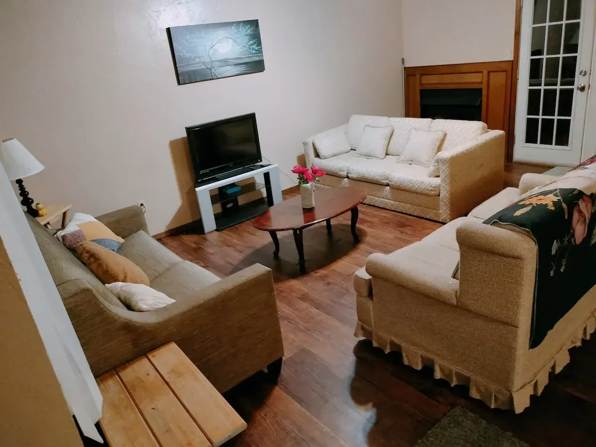 A living room filled with furniture and a television
