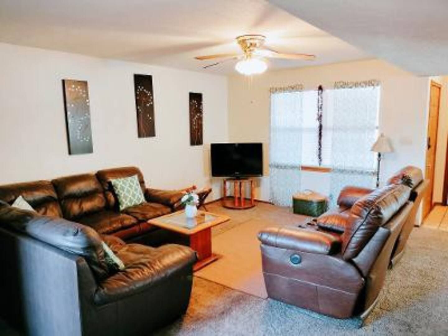 A living room filled with furniture and a flat screen tv