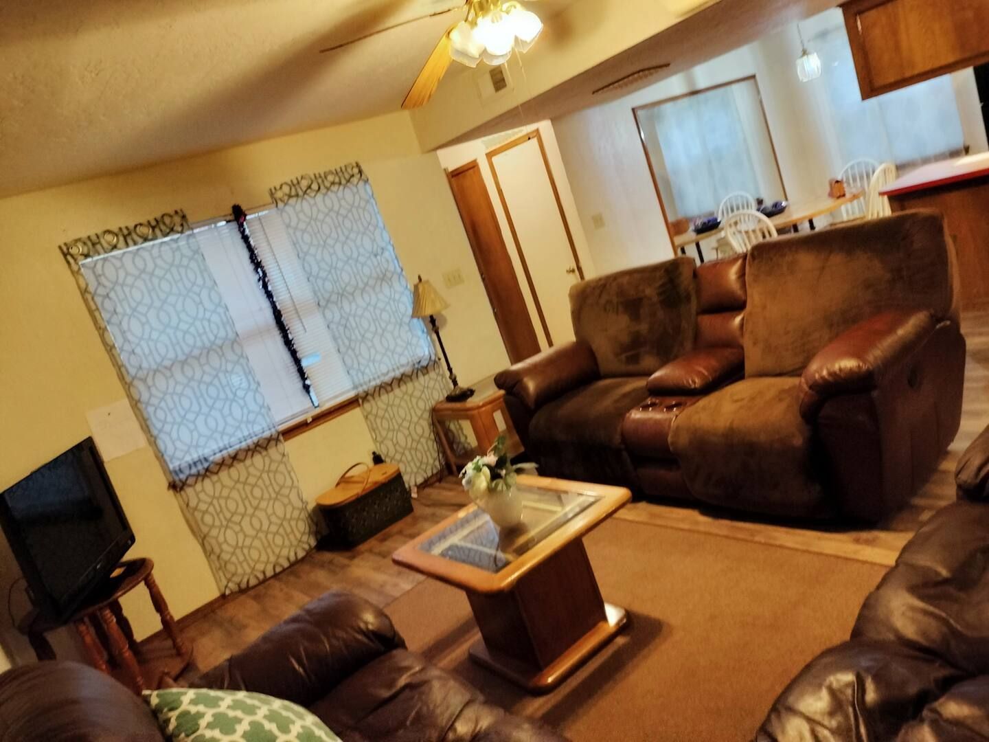 A living room with a couch a chair and a coffee table