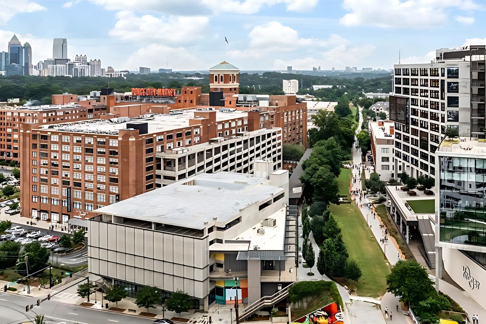 An aerial view of a city with lots of buildings and trees
