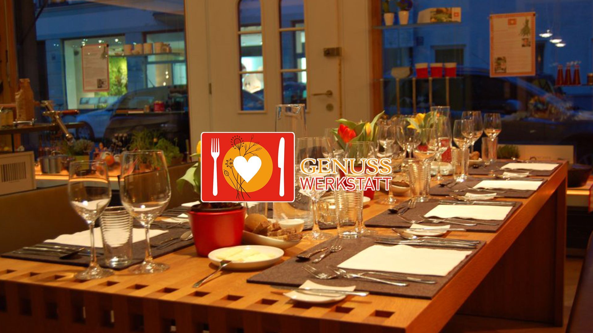 A long wooden table with a sign that says i love food