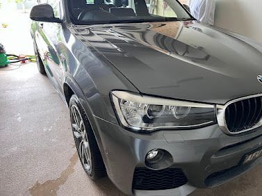 Grey BMW SUV Parked In A Garage, Front-left View — Car Detailing Mobile Cleaning Co In Port Macquarie, NSW