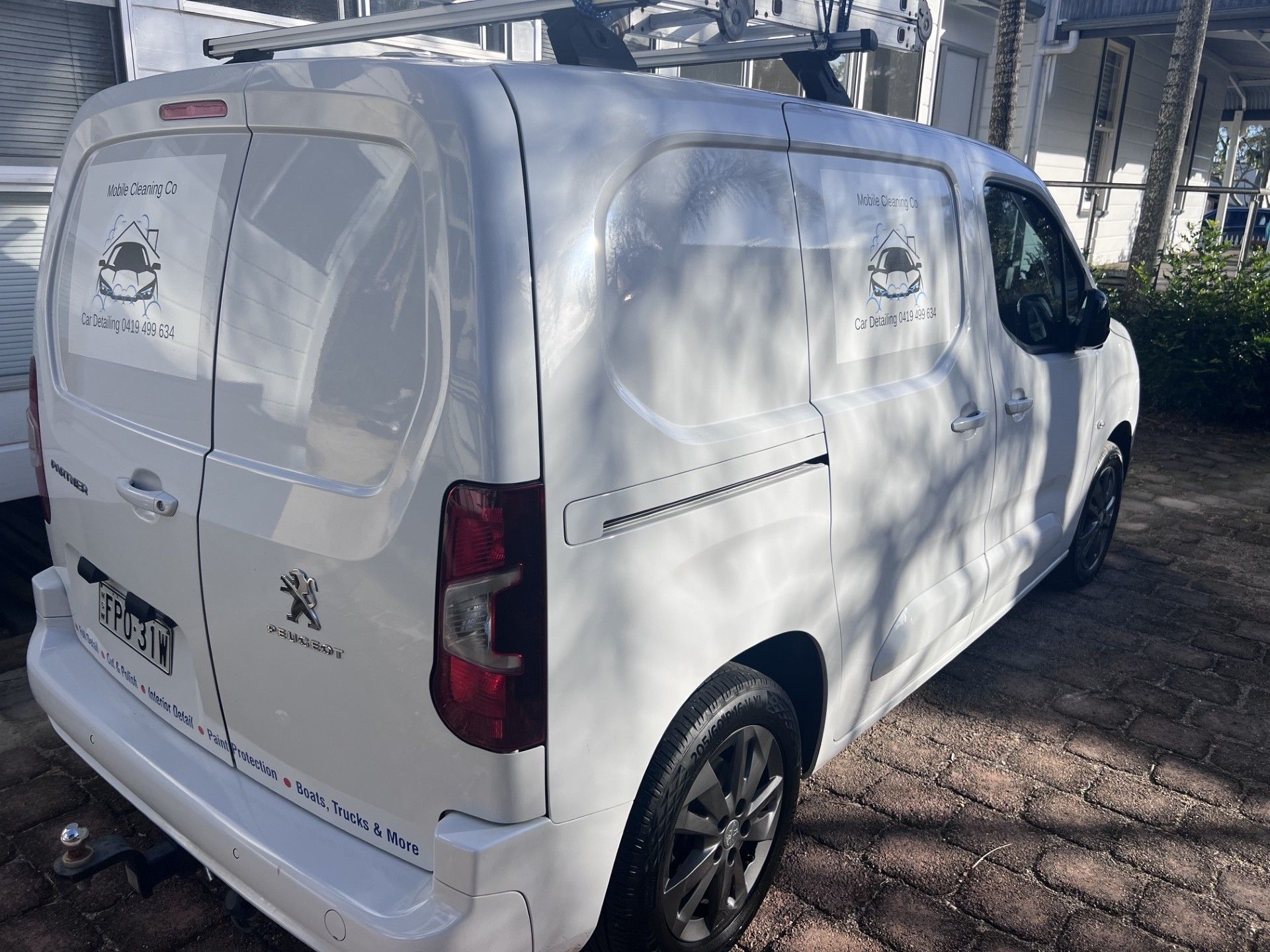 White Peugeot Cargo Van Parked Outdoors In A Lot, Viewed From The Rear-left Side — Car Detailing Mobile Cleaning Co In Port Macquarie, NSW
