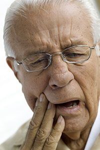 Elderly Man Suffering from Toothache — Orange, CT — New England Dental Health Services PC Elderly Man Suffering from Toothache — Orange, CT — New England Dental Health Services PC