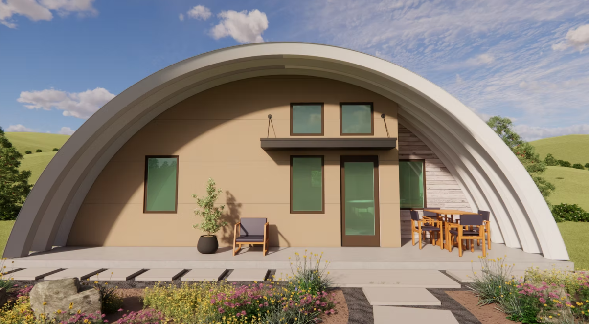 Modern arched house with beige facade, green-trim windows and door, patio chairs, and landscaped garden.