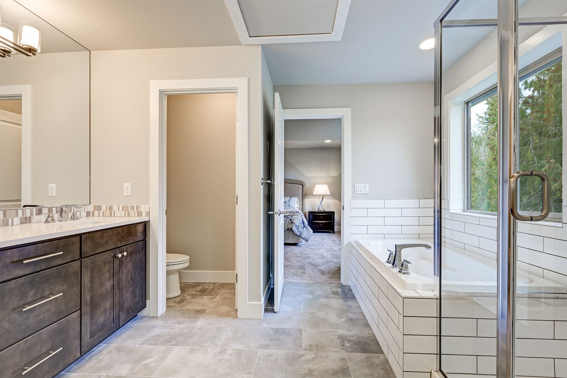 a bathroom with a walk in shower and a bathtub .
