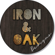 a sign that says iron and oak designs on it