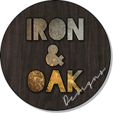 a sign that says iron and oak designs on it