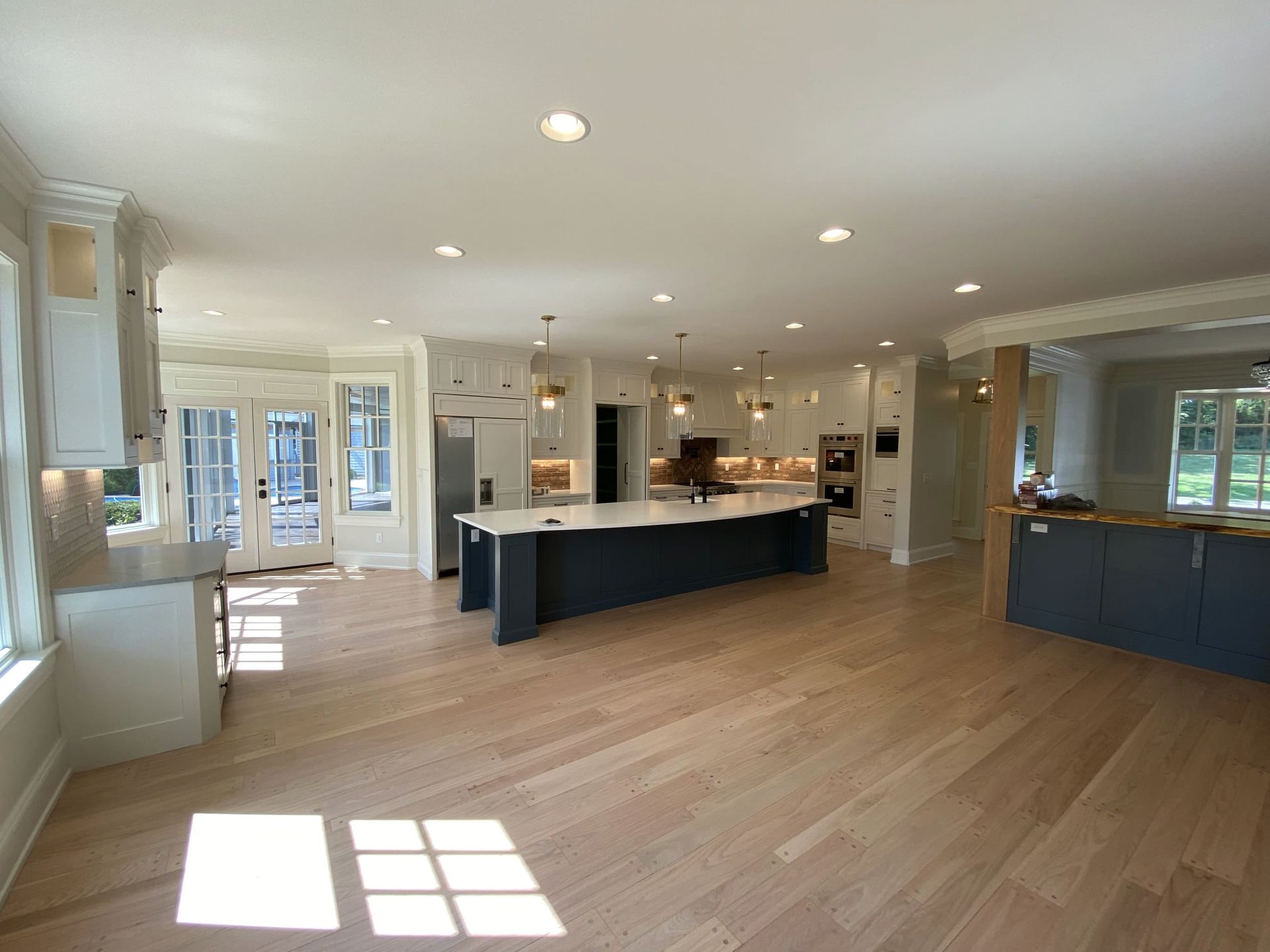 A large kitchen with a large island in the middle