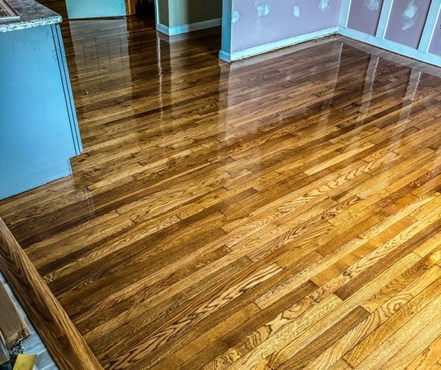 A close up of a wooden floor in a room.