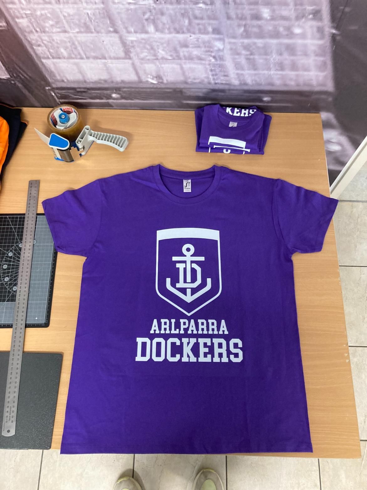 a Purple T-shirt That Says Arlparra Dockers on It — Pinpoint In Alice Springs, NT