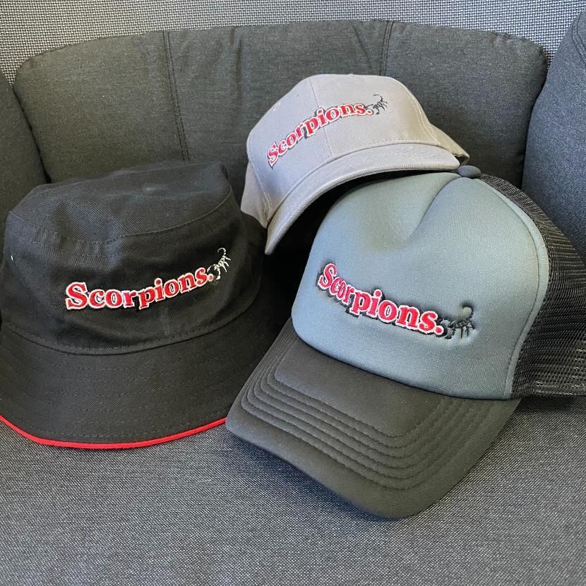 Three Hats With the Word Scorpions on Them — Pinpoint In Alice Springs, NT
