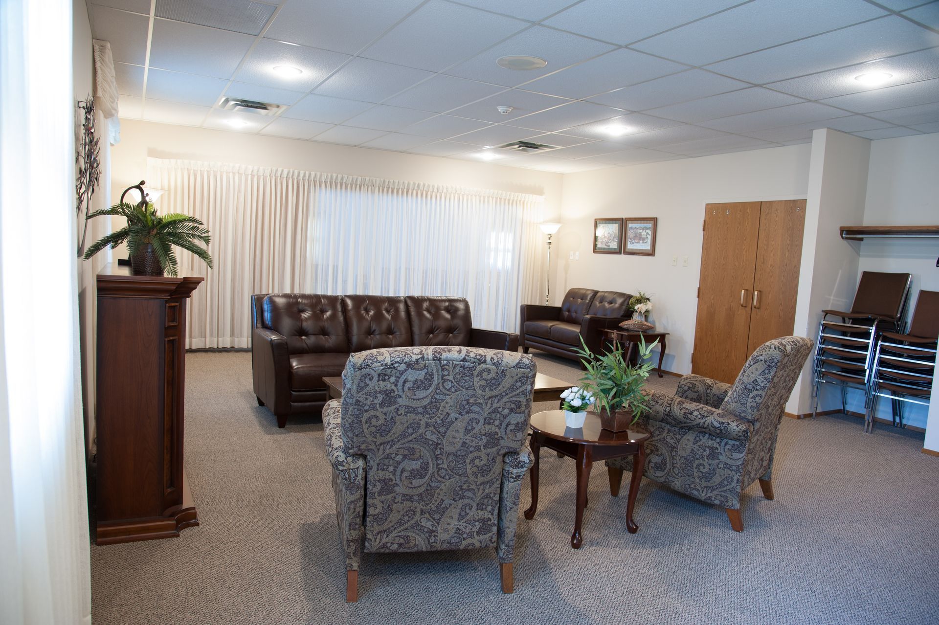 a living room with a couch and two chairs
