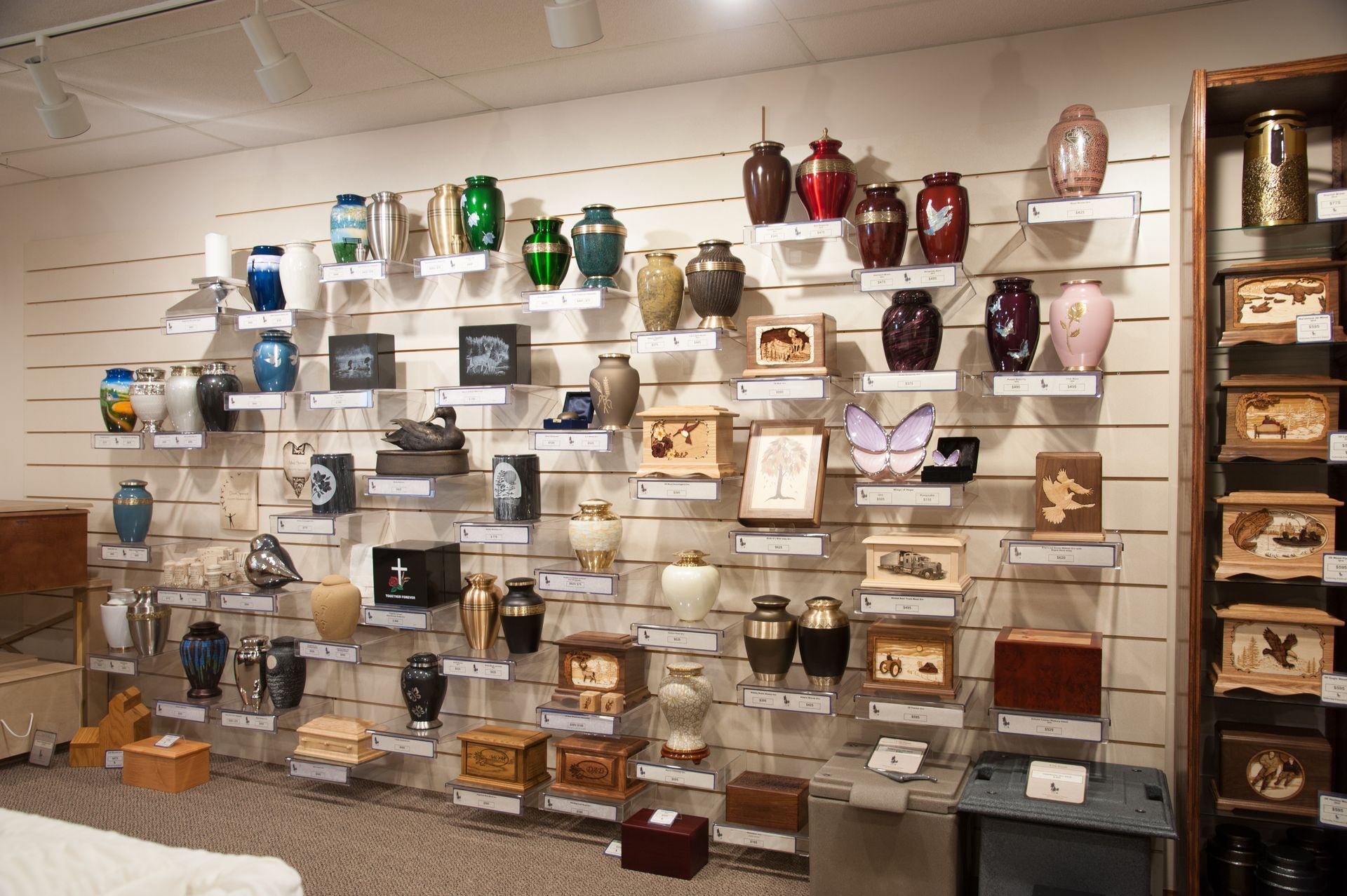 a display of urns including one that says ' i love you ' on it