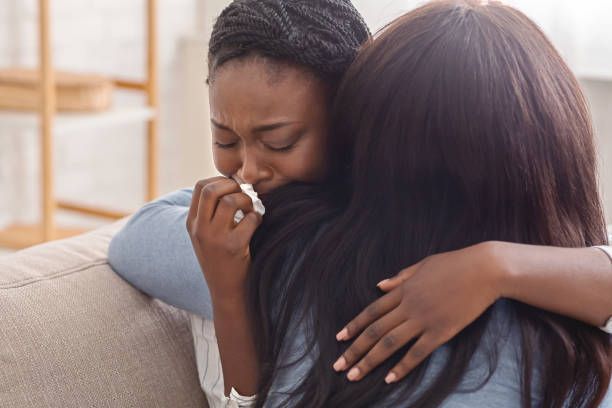 A women comforting her friend