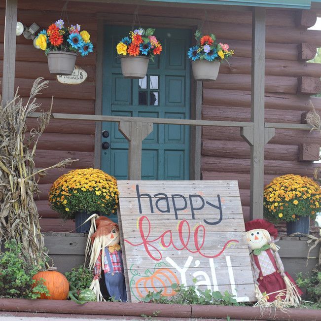 A wooden sign that says happy fall y'all on it