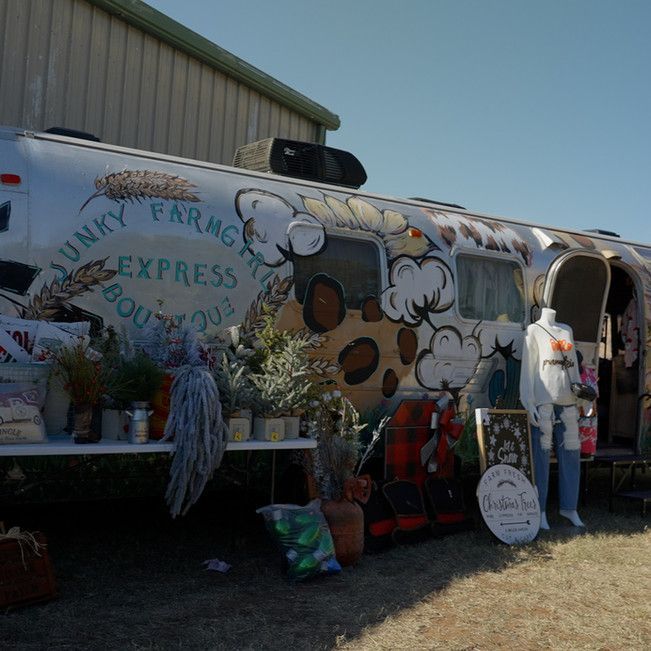 A truck that says ' funky farmhouse express boutique ' on it