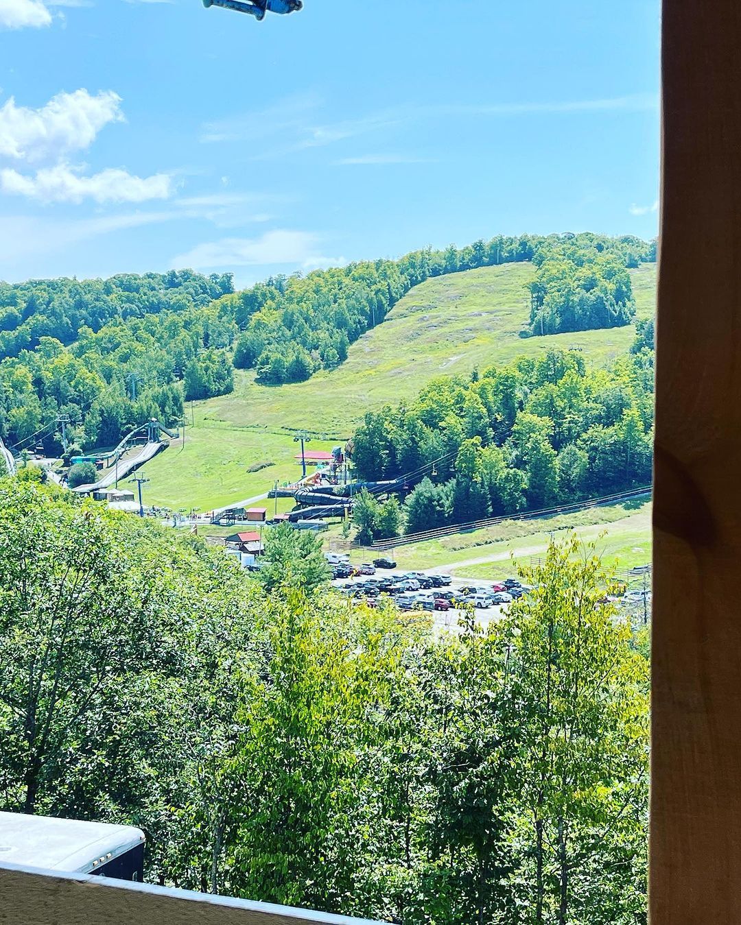A view of a ski slope from a balcony
