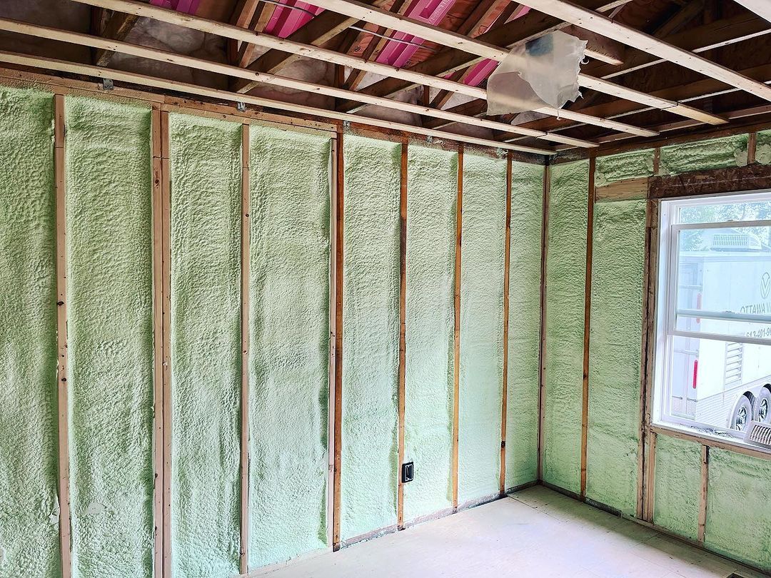 A room with green insulation on the walls and ceiling.